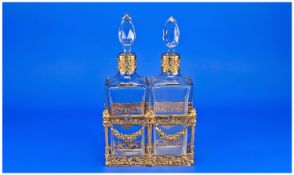 French Baccarat Style Two Bottle Tantalus, in fine quality cast gilded metal frame with floral