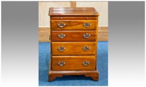 Reproduction Chippendale Style Miniature Chest Of Four Graduating Drawers, With Brushing Slide And