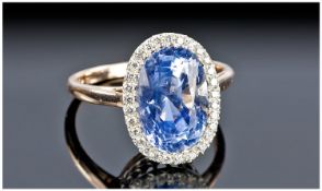 Sapphire And Diamond Ring, Large Central Oval Sapphire (Approx 7.5cts) Surrounded By Round Modern