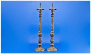Pair of Brass Pricket Candlesticks, each comprising a circular spread base below bowl and baluster