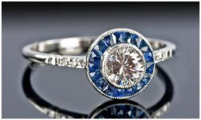 Art Deco Style Diamond & Sapphire Ring, The Central Round Single Stone Diamond Surrounded By Approx