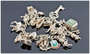 Silver Charm Bracelet Loaded With Approximately 20 Charms, Complete With Padlock Fastener