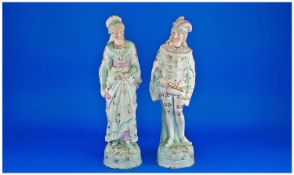 Late 19th Century Hand Painted Pair of Bisque Figures in 17th Century Dress. Each stands 15.75