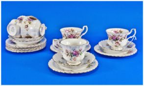 Royal Albert `Moss Rose` comprising 6 cups and saucers, side plates and two extra side plates.