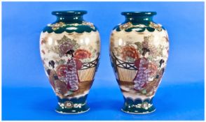 Japanese Pair of Satsuma Vases, early 20th century. Character marks to base. Each stands 10 inches