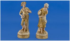 Royal Dux Pair Of Water Carrier Figures, Circa 1900. Pink triangles to bases. Each figure stands 8.