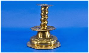 17th Century Dutch Embossed Brass Table Candlestick, with a twist column, supported by an embossed