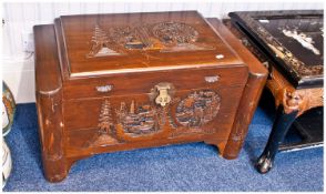Carved Chinese Camphor Wood Chest. The top carved with a typical Chinese scene of Pagodas in formal