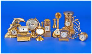 A Good Collection Of Gold Plated Miniature Clocks, in various forms and sizes. 9 in total. All