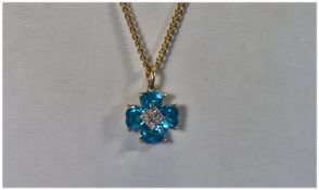 9ct Gold Diamond and Blue Topaz Pendant Drop, fitted on a 9ct gold chain.