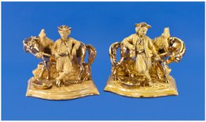 Pair of German Eichwald Brown Glazed Gilt Flashed Pottery Figural Pipe Racks. Depicting a farmer
