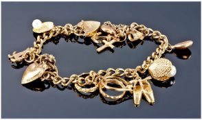 9ct Gold Charm Bracelet Loaded With 10 Charms. All fully hallmarked. 18.8 grams