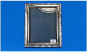 A Large Silver Photo Frame Of Good Quality, with cloth back and strut. Hallmark London 1990. Size