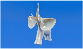 Hollohaza Porcelain (Hungary). A fine elephant with trunk raised and ears flapping. Factory mark to