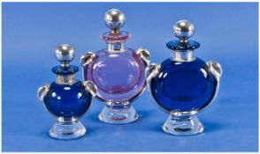 A Fine Matching Set of Art Form Shaped Coloured Glass Perfume Bottles - 3 in total, with silver