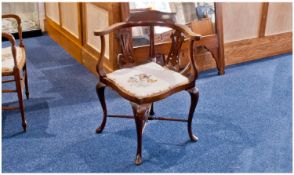 Edwardian Mahogany Corner Chair on Cabriole Legs, with shaped arms with scroll ends. Two pierced