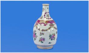 Chinese Style Bottle Shaped Vase, with a short neck on a bulbous body. Decorated in the famille