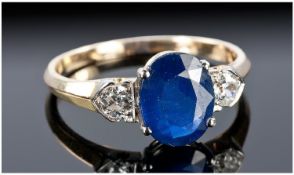 14ct Gold Sapphire And Diamond Ring, Central Oval Sapphire Set Between Two Round Cut Diamonds,