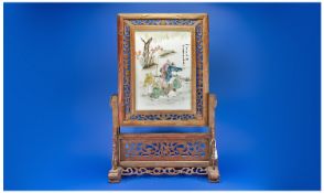 Large Oriental Style Porcelain Screen with fitted carved wooden stand.