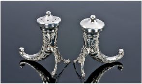 A Good Norwegian Sterling Silver Salt and Pepper of horn shape. Each traditionally decorated and