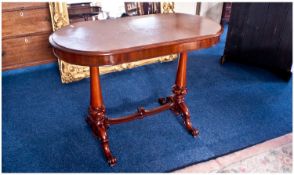 Victorian Mahogany Side Table of Oval Form on two carved pillars, ends connected to a central