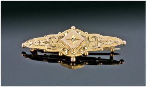 A 9ct Gold Bar Brooch. c1900. Marked 9 carat and maker S. Bros.