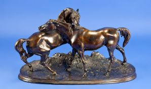 20th Century Bronzed Figure, mare and stallion at play on a grassy bank. Unsigned. 7.75 inches