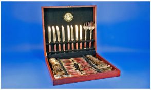 60 Piece Cased Canteen of Cutlery, with brass forks and knives with rosewood handles. Made in