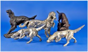 Three Silvered Metal Models of Retriever Dogs, with two bronzed resin dogs.