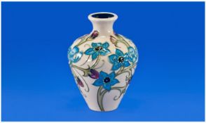Moorcroft Small Vase ``True Blue `` Design. Date 2012. Red spot to base. 4 inches high.