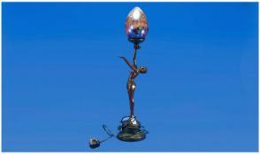 Art Deco Style Bronzed Figural Lamp, a semi nude woman with outstretched arms holding a large egg