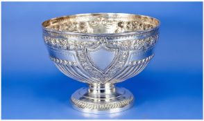 A Victorian Fine Silver Rose Bowl, with embossed floral decoration and ribbed body. The vacant