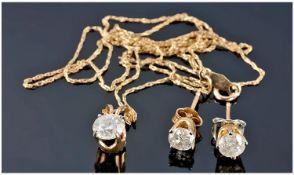A Pair Of 9ct Gold Set Single Stone Diamond Stud Earrings, with matching single stone diamond