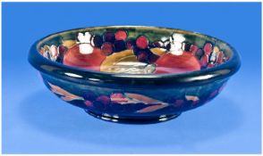 William Moorcroft Signed Footed Bowl Circa 1916-1918. `Pomegranate & Berries` on blue ground.