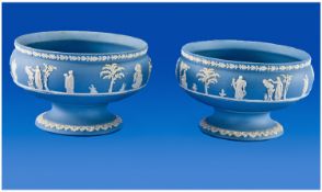 Pair of Wedgwood Jasperware Comports, each decorated with raised Classical imagery on a blue
