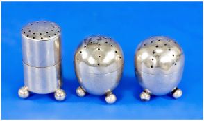 Pair of Silver Ovoid Pepperettes and One Straight Sided, Similar, the pair with screw tops and each