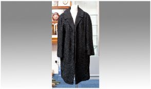 Black Persian Lamb Full Length Coat, narrow, self lined collar with revers, slit pockets, clip hook