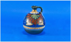 Gouda `Rhodian` Bulbous Ewer, the curvilinear design in muted tones of yellow, sienna, French blue