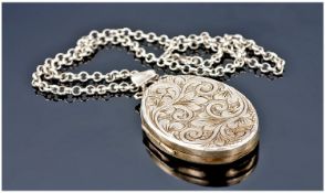 Silver Locket And Chain. Locket 1.5 inches high, chain 14 inches in length. Fully hallmarked.