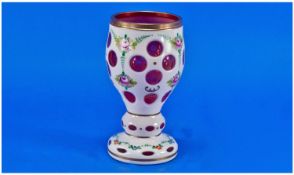 Bohemian Overlaid Glass Goblet Vase, white glass overlaid on a ruby ground, cut away in circles,