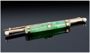 Gold Bar Brooch Mounted With A Tubular Jadeite Stone, Central Seed Pearl And Seed Pearl Terminals.