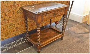 Carved Oak Single Draw Side Table. The top, sides and fronts profusely carved. On four barley twist