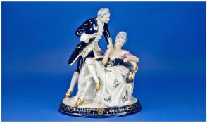 Royal Dux Porcelain Group Of Lovers, decorated in under glazed blue and gilt. Depicting an elegant