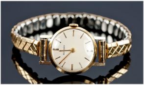 Rotary Manuel Wind 9ct Gold Cased Ladies Wrist Watch, fitted on gold plated expanding bracelet.