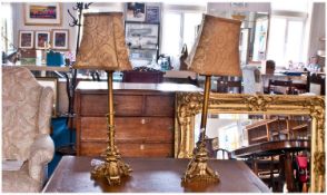 Pair of Modern Metal and Resin Ormalu Finished Lamps in the regency style, terminating in three