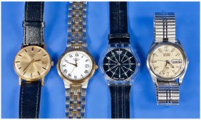 A Collection Of Four Gents Wrist Watches. Includes: 1, Seiko Quartz day/date, stainless steel wrist