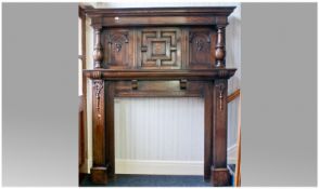 Large Oak Jacobean Style Fireplace, with geometric paneled top, with baluster side pillars. The