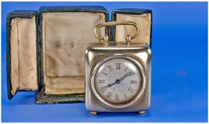 Edwardian Small Brass Cased Square Shaped Travellers Clock. Pearl dial, 8 day/alarm. With original