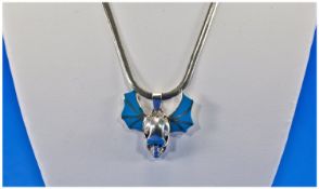 Silver And Enamel Skull Pendant With Wings, Suspended On A Snake Link Chain.