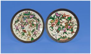 A Large Chinese Pair of Crackle ware Pottery chargers of shallow form. Finely painted with warring